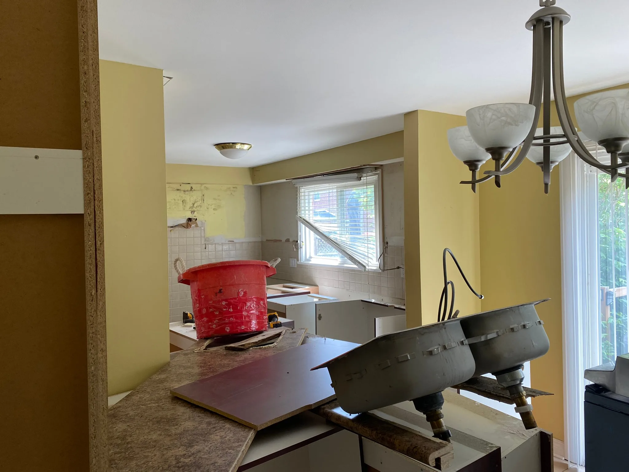Kitchen remodel in progress with old cabinets.